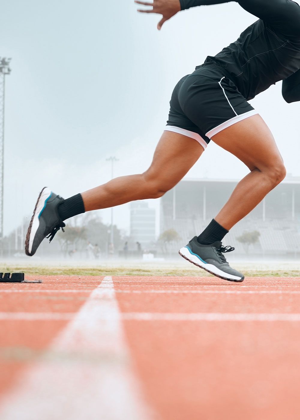 Athlete sprinting on a running track