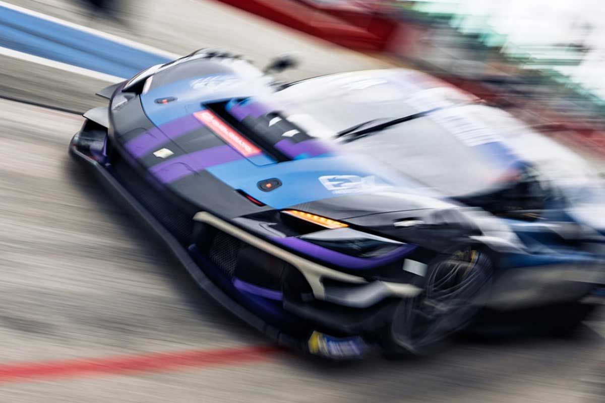 Motion-blurred GT car cornering