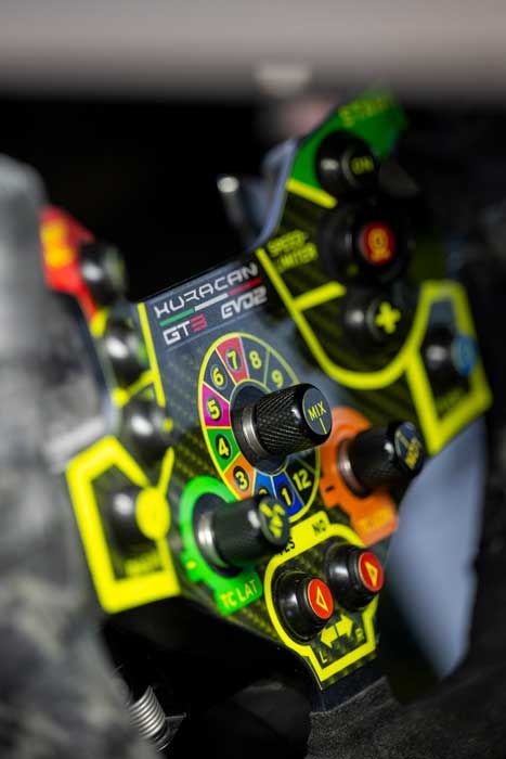 Illuminated controls on a racing car steering wheel