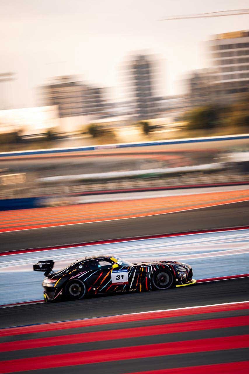 GT car at speed on a circuit