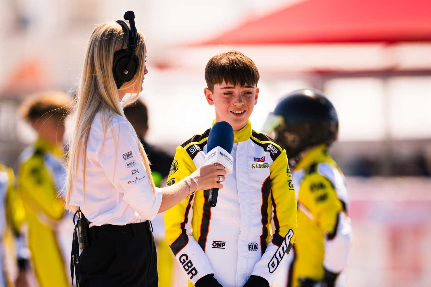 Young driver giving an interview to the media